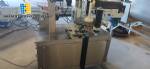 Automatic self-adhesive labeling machine for cylindrical bottles