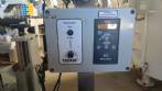 Automatic self-adhesive labeling machine for cylindrical bottles