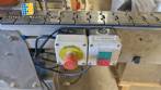 Automatic self-adhesive labeling machine for cylindrical bottles
