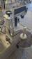 Automatic self-adhesive labeling machine for cylindrical bottles