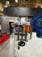 Automatic self-adhesive labeling machine for cylindrical bottles