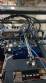 Pick and place product feeder for flowpack transfer cartoning machine