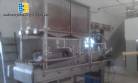 Treadmill with silo and vibrating gutter