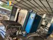 Automatic baling machine with shrink tunnel for bottles and jars in bales.