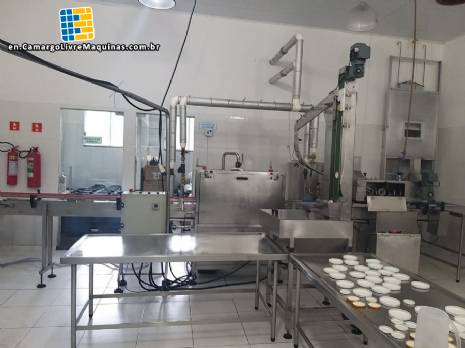 Line for brine filling manual product insertion and automatic capping