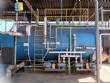Wood-fired flame tube boiler for steam generation
