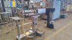 Filling machine with 2 nozzles for liquids and pilfer cap screwer