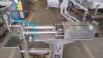 Filling machine with 2 nozzles for liquids and pilfer cap screwer