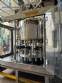 Packaging line with IMSB bung capper, Maqmundi labeler and accumulator table