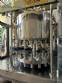 Stainless steel rotary filling machine with 16 IMSB nozzles for bottles and jars