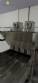 Automatic stainless steel deep fryer for donuts and cream puffs.