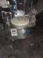 Erli rotary liquid filling machine with 4 pistons, 14,400 units per hour.