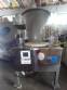 Erli rotary liquid filling machine with 4 pistons, 14,400 units per hour.