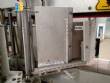 Automatic labeler for flat bottles