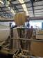Vertical wrapping machine for triangular format