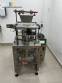 Automatic volumetric dosing packaging machine for powder products.