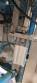 Bottle and jar screwing machine with automatic cap feeding system
