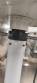 Bottle and jar screwing machine with automatic cap feeding system