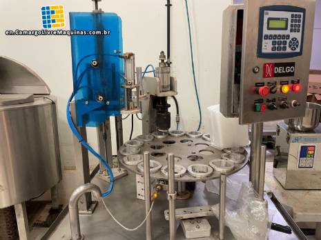 Stainless steel rotary sealer with aluminum seal for Delgo jars, cups and bottles.