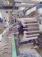 Hoppmann bottle positioner with conveyor belt