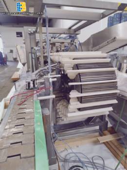 Hoppmann bottle positioner with conveyor belt