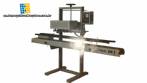 Welding machine for plastic bags with motorized treadmill
