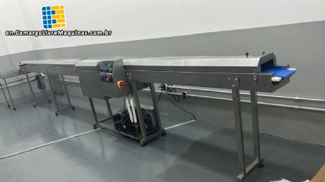 Chocolate coating machine with cooling tunnel for AGUIATECH coatings.