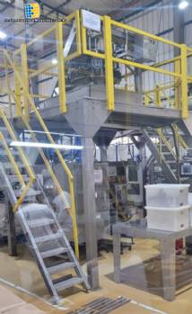 Masipack 16 Twin multi-head vertical packaging machine with conveyor belt and platform.