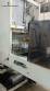 Labeling machine with steam sleeve tunnel and bottle baler