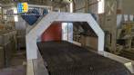 Labeling machine with steam sleeve tunnel and bottle baler