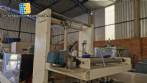 Labeling machine with steam sleeve tunnel and bottle baler