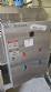 Labeling machine with steam sleeve tunnel and bottle baler