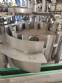 Zegla rotary filling machine with rinser and three-block capping system.