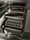 Automatic filling and sealing machine for gelatin cups, 12,000 units/hour.