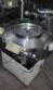 Rotary feeder of bullets and chewing gum type Flow Pack machines