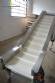 Stainless steel belt with MCI cleat