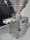 Handtmann vacuum stuffer with twister and tilting elevator, up to 6,000 kg per hour.