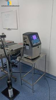 Conveyor belt with dater and 10 meter stainless steel support table Conveyor belt with dater and 10 meter stainless steel support table