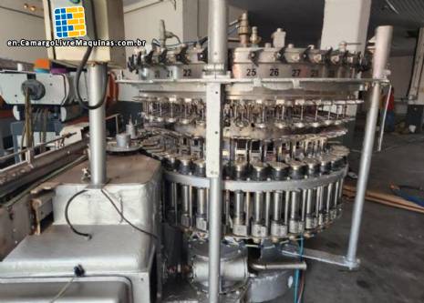 Stainless steel rotary filling machine for carbonated beverages and soft drinks, 60 nozzles, KHS with Zegla washer. Stainless steel rotary filling machine for carbonated beverages and soft drinks, 60 nozzles, KHS with Zegla washer.